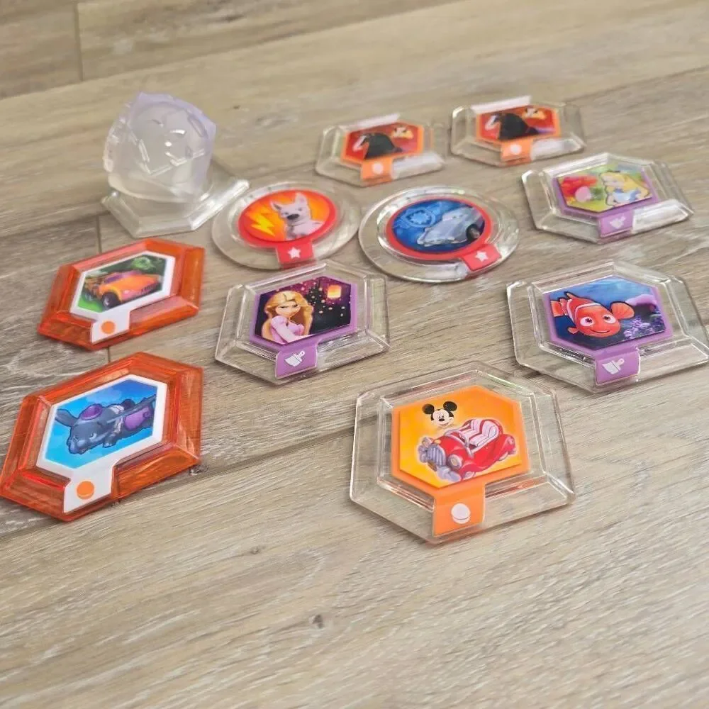 Disney Infinity power disc's lot of 11 Mulan, mickey, rapunzel, Alice, Nemo, car